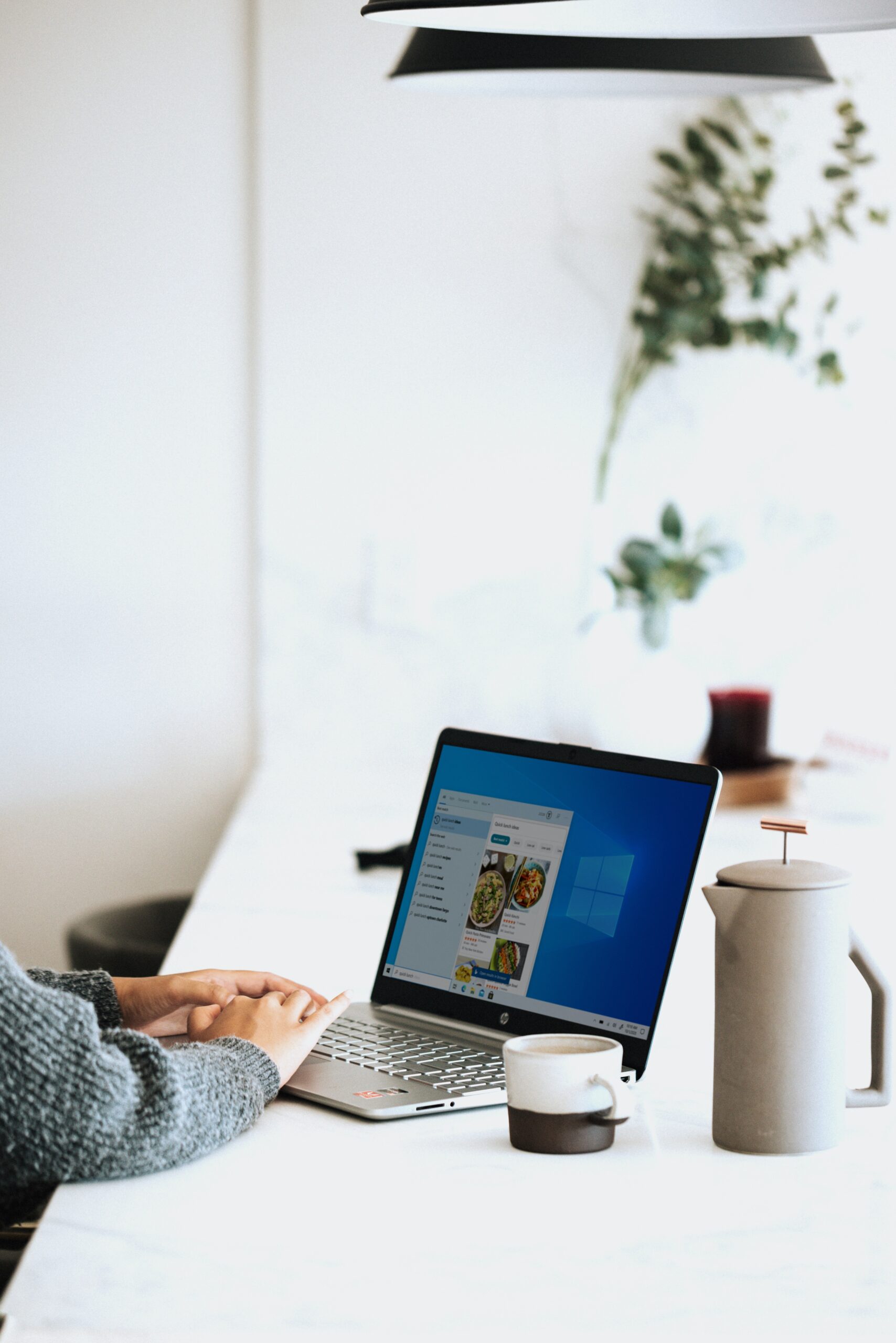 Laptop, mug, and jug